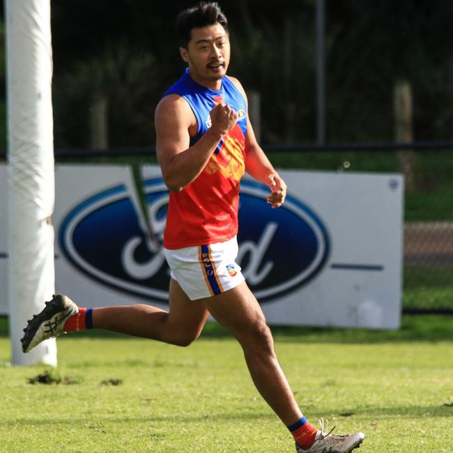 Lin Jong celebrates a goal for Mulgrave this season. Picture: Davis Harrigan