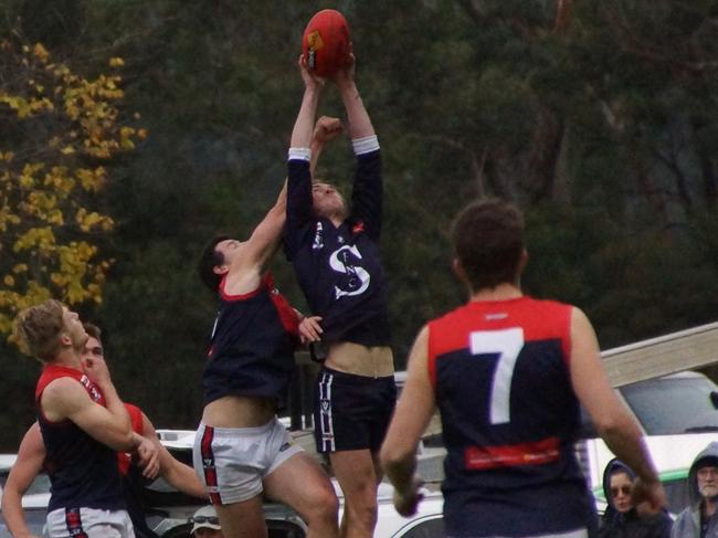 AFL Yarra Ranges Div 2 Round 6 match between Seville and Powelltown. Seville 23. 14 (152) defeated Powelltown 9.15 (69). Seville’s Joshua Neal flies for the mark, with his Powelltown opponent Matt Pote coming in for the knock out. Picture: Robyn Kuys