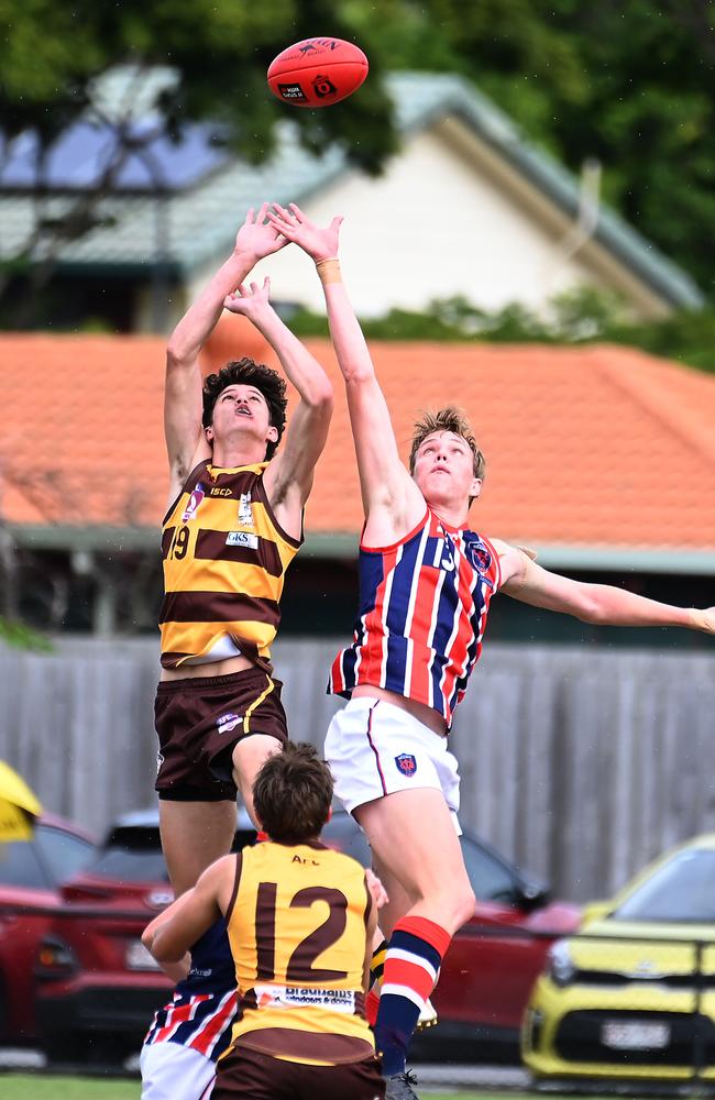 Aspley player Duncan Lewis and Wilston Grange player Marcus Zipf QAFL colts between Aspley and Wilston Grange. Saturday May 4, 2024. Picture, John Gass