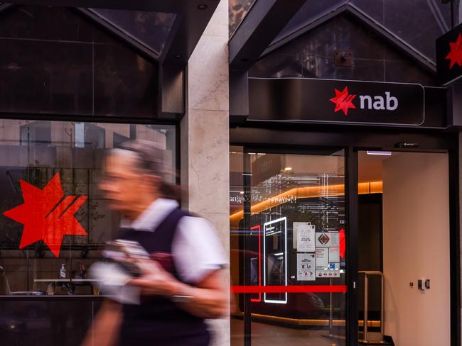 MELBOURNE, AUSTRALIA - MAY 03: A person is seen walking past a NAB (National Australian Bank) branch on May 03, 2022 in Melbourne, Australia. The Reserve Bank of Australia has today lifted the official interest rate to 0.35 per cent following a meeting today. The Reserve Bank of Australia has today lifted the official interest rate to 0.35 per cent following a meeting today. The rise is the first interest rate increase since November 2010. (Photo by Asanka Ratnayake/Getty Images)