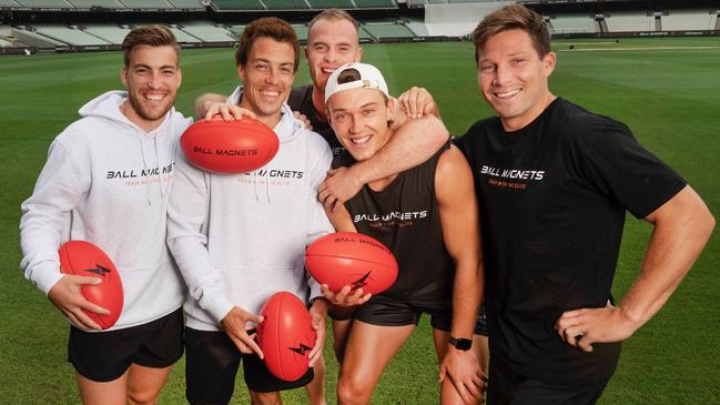 Todd Viney, Dylan Shiel, Tom Mitchell, Patrick Cripps and Toby Greene promoting the Ball Magnets app, designed to inspire kids. Picture: Supplied