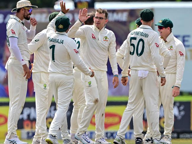 Murphy celebrates with teammates after taking the wicket of Sri Lanka's veteran opener Dimuth Karunaratne Picture: AFP