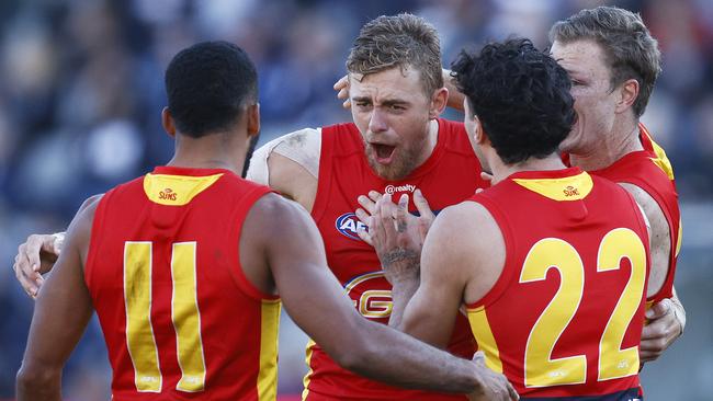 GEELONG, AUSTRALIA - MAY 22: Hugh Greenwood of the Suns (C) celebrates a goal during the round 10 AFL match between the Geelong Cats and the Gold Coast Suns at GMHBA Stadium on May 22, 2021 in Geelong, Australia. (Photo by Daniel Pockett/Getty Images)