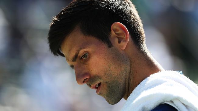 Novak Djokovic of Serbia reacts to a lost point against Benoit Paire.