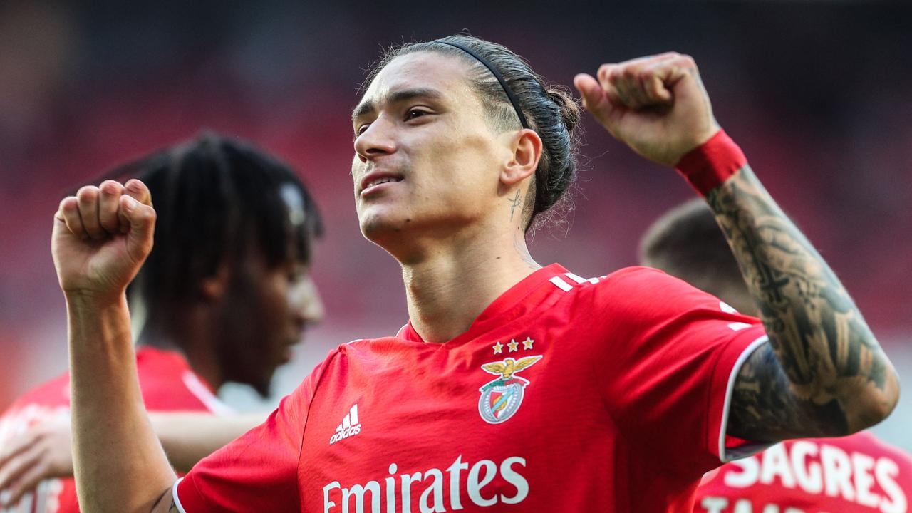(FILES) In this file photo taken on April 9, 2022 Benfica's Uruguayan forward Darwin Nunez celebrates after scoring a goal during the Portuguese league football match between SL Benfica and Belenenses SAD at the Luz stadium in Lisbon. - Liverpool are reportedly close to signing Benfica's Uruguay striker Darwin Nunez in a deal which could be worth up to Â£85 million ($104 million). (Photo by CARLOS COSTA / AFP)