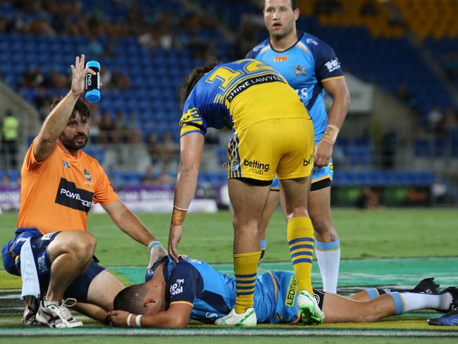 Ash Taylor lies injured on the ground. Picture by Scott Fletcher