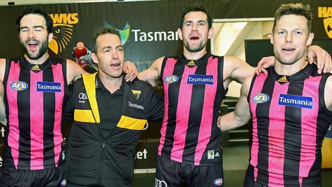 Jordan Lewis, Alastair Clarkson, Luke Hodge and Sam Mitchell of the Hawks sing the song in the rooms after a win in 2016. Lewis and Mitchell are now at other clubs.