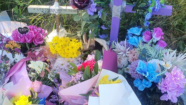 Tributes left at the scene on Boundary Road where Hervey Bay mum Tash Raven was killed in an alleged hit and run.
