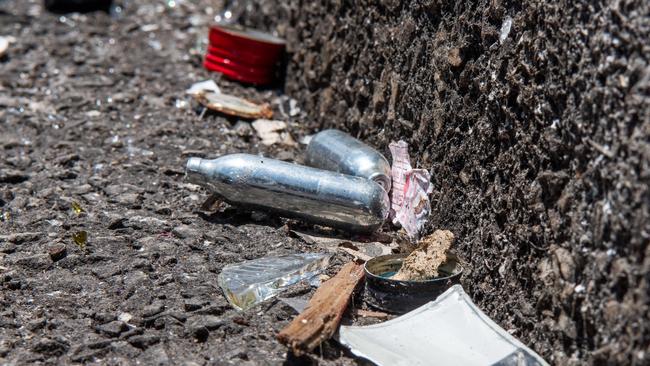 22 'nangs' – found in aerosol deodorants and used for chroming – were found in a single car park near the Rydges hotel in the Darwin CBD. Picture: Pema Tamang Pakhrin