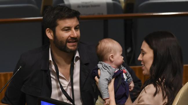 Jacinda Ardern, Prime Minister and Minister for Arts, Culture and Heritage, and National Security and Intelligence of New Zealand holds her son Neve Te Aroha Ardern Gayford, as her husband Clarke Gayford looks on during the Nelson Mandela Peace Summit September 24, 2018, one  a day before the start of the General Debate of the 73rd session of the General Assembly at the United Nations in New York. (Photo by Don EMMERT / AFP)