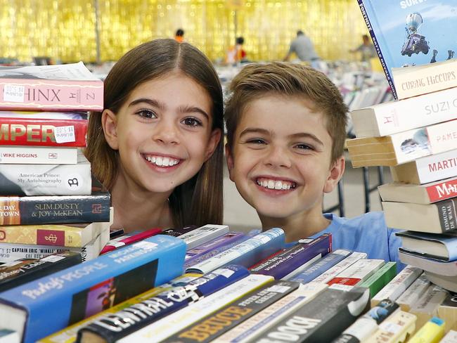 Ayla Shephard, 10, and her brother Arden Shephard, 12, at the The Gold Coast Bookfest in Carrara. Picture: Tertius Pickard