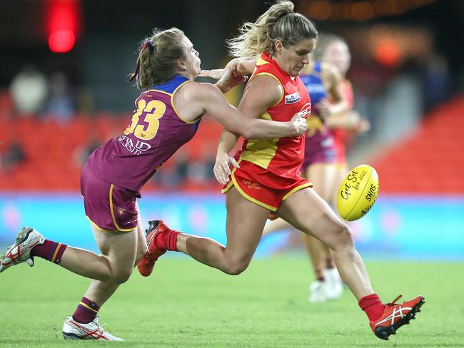 Maddy Roberts of the Suns (right) is tackled by Maria Moloney of the Lions during the AFL QW Winter Series match between the Gold Coast Suns and the Brisbane Lions at Metricon Stadium on May 25, 2019 in Gold Coast, Australia. (Photo by Jono Searle/AFL Photos/Getty Images)