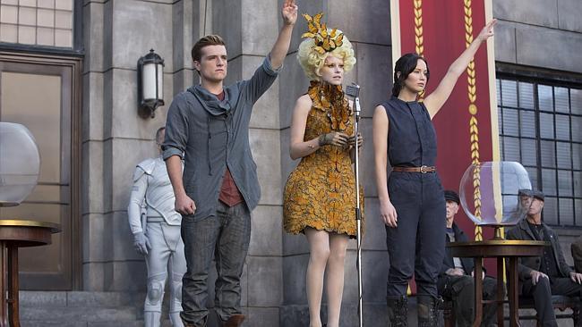 Josh Hutcherson as Peeta Mellark, Elizabeth Banks as Effie Trinket and Jennifer Lawrence as Katniss Everdeen in a scene from The