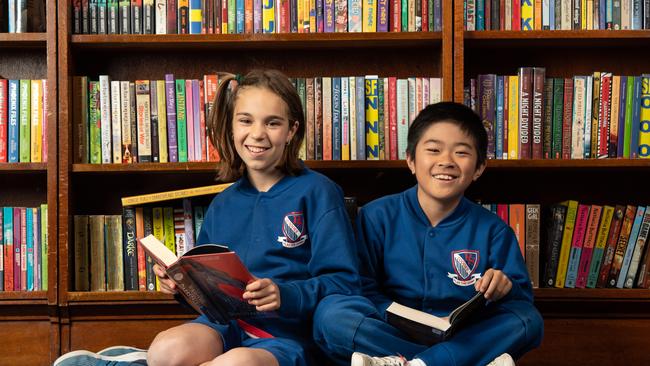 Sienna Guzzardi and Sora Syrett enjoying their books as part of the challenge. Picture: Monique Harmer