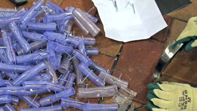 A protester makes nail roadblocks inside the campus of the University of Hong Kong, early on Thursday. Picture: Kin Cheung/AP