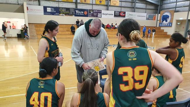 Former NBL player Jason Joynes, who lost his battle with cancer earlier this month, coaching his daughter Scarlett’s basketball team. Picture: Supplied by family