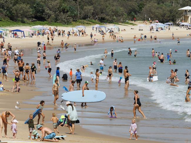 Holiday crowds at Noosa Main Beach. Picture Lachie Millard