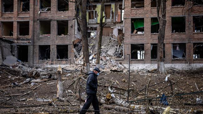 A man walks in front of a destroyed building after a Russian missile attack in the town of Vasylkiv, near Kyiv. Picture: Dimitar Dilkoff / AFP