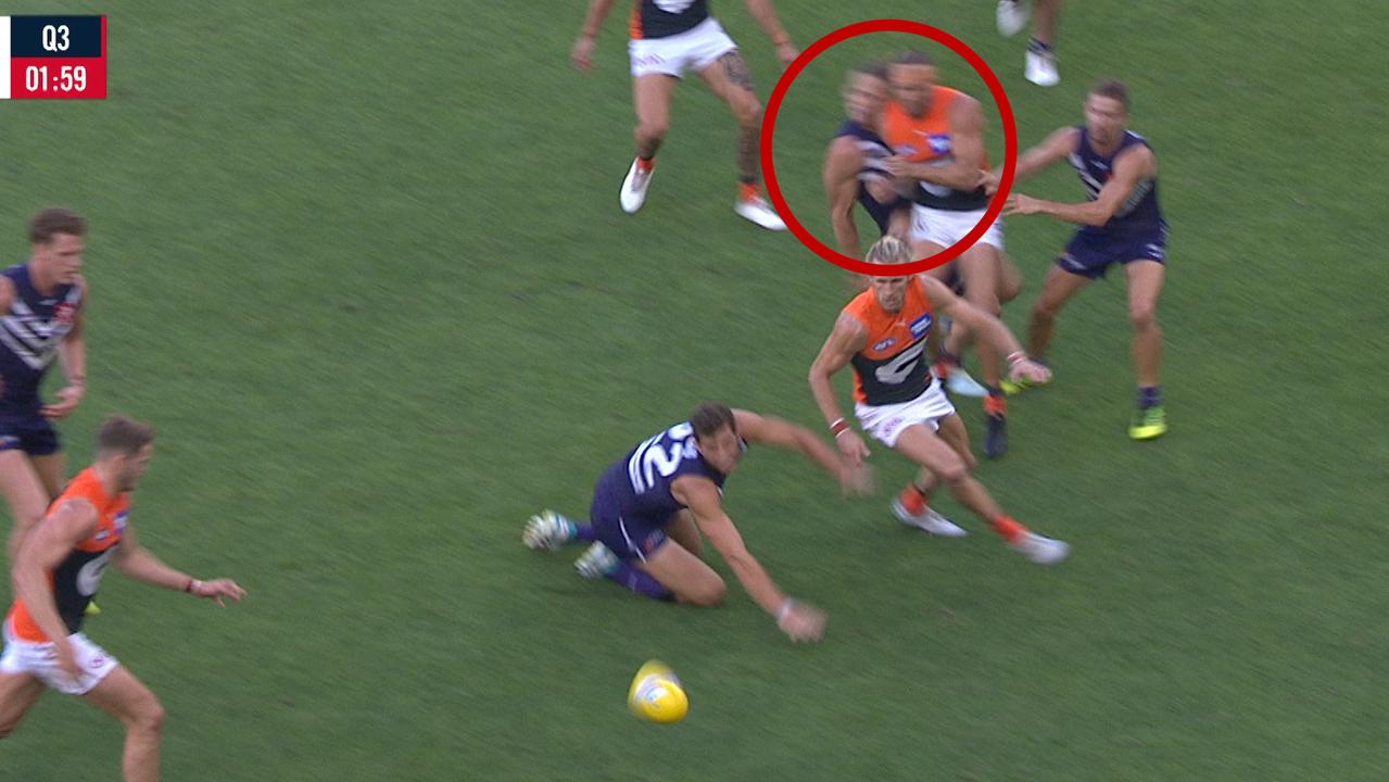 Nat Fyfe collides with Sam Reid.