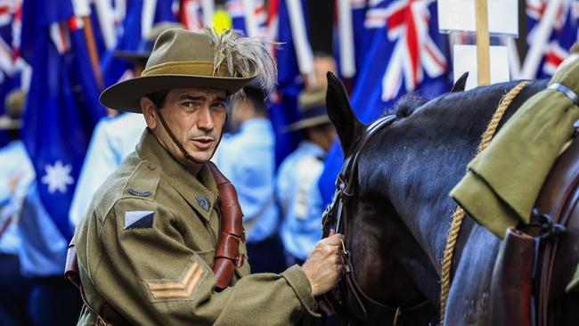 A member of the Defence Force holds his horse ahead of the Anzc Day parade. Picture: Mark Evans/Getty Images