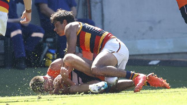 Adelaide's Shane McAdam was suspended for this hit on the Giants’ Jacob Wehr. Picture: Phil Hillyard