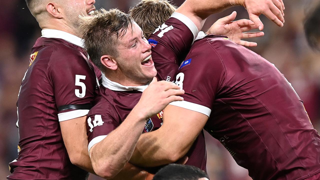 Harry Grant of the Maroons celebrates after scoring a try.