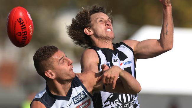 Chris Mayne battles with Liam Jones, another controversial recruit, in the VFL. Picture: Stuart Milligan