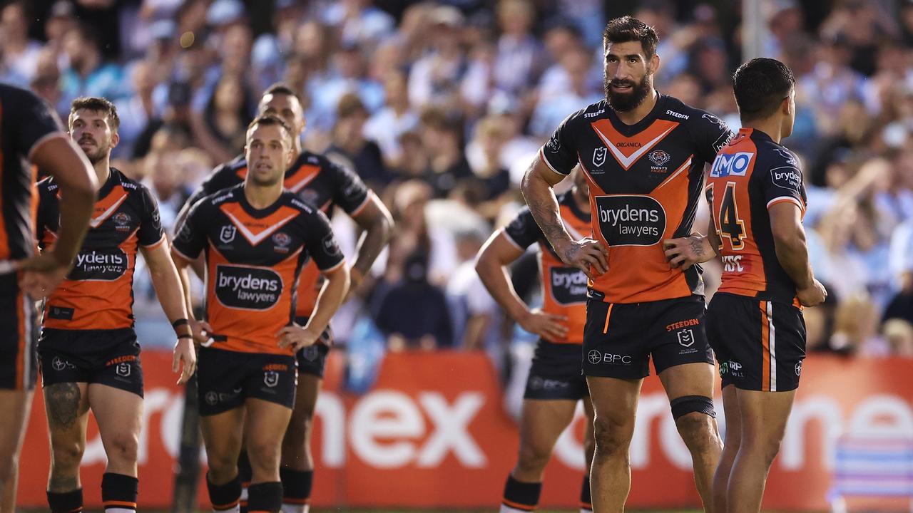 SYDNEY, AUSTRALIA - APRIL 10: James Tamou of the Tigers and his team mates look dejected after a try during the round five NRL match between the Cronulla Sharks and the Wests Tigers at PointsBet Stadium, on April 10, 2022, in Sydney, Australia. (Photo by Mark Kolbe/Getty Images)