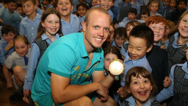 Tom Burton with his excited fans.