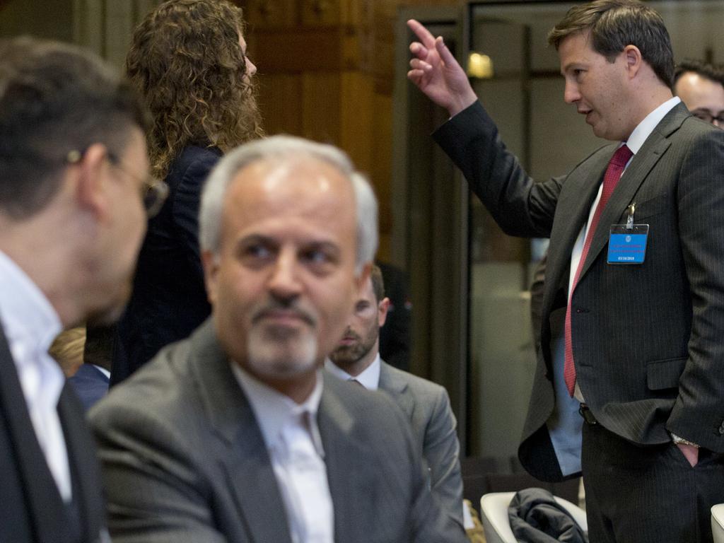 Mohammed Zahedin Labbaf, agent for the Islamic Republic of Iran, (second left), at the International Court of Justice where judges ruled against the US sanctions on Iran. Picture: AP Photo/Peter Dejong