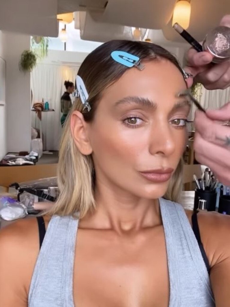 Nadia opted for a bronzed look for the beach photo shoot to promote her fake tan company. Picture: Instagram/Nadiabartel