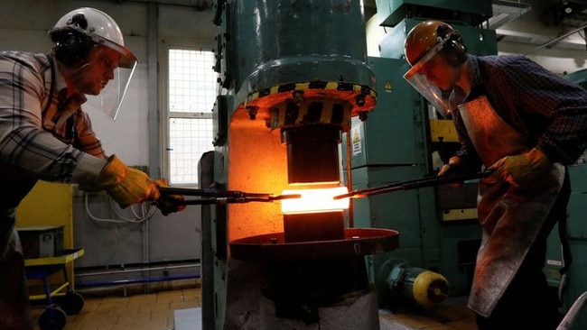 Russia is a major supplier of palladium. Above, employees at a plant of a Russian supplier shape a palladium ingot in 2019. Picture: Reuters