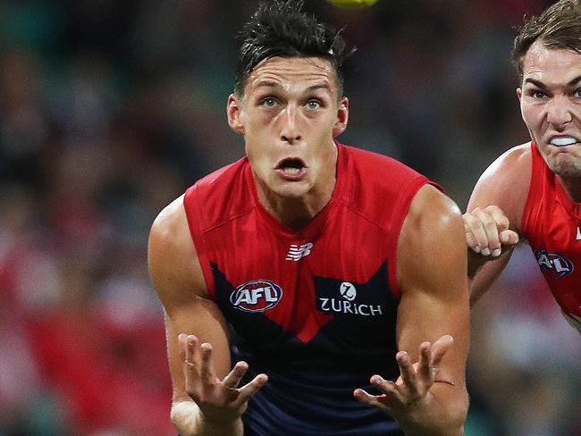 Melbourne's Sam Weideman marks in front of Sydney's Jackson Thurlow during AFL match between the Sydney Swans and Melbourne Demons at the SCG. Picture. Phil Hillyard