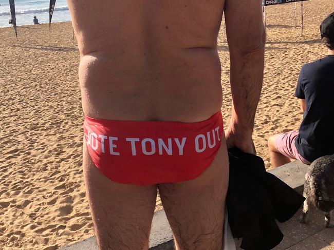 Wrong election: One voter out early at North Steyne, Manly, has a message for Federal MP Tony Abbott. Picture: Julie Cross