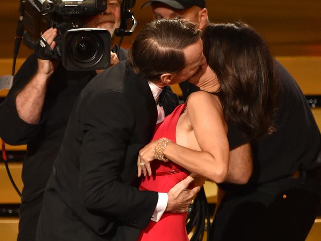 Julia Louis-Dreyfus was pashed by Bryan Cranston onstage at the 2014 Emmy Awards.