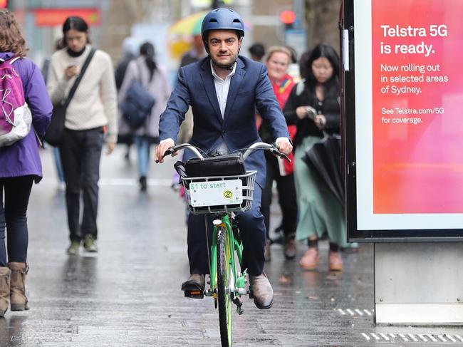 Sam Dastyari arrives at the ICAC hearing in Sydney on a hired pushbike. Picture: John Grainger