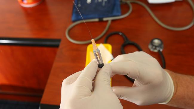 A measles vaccine shown.