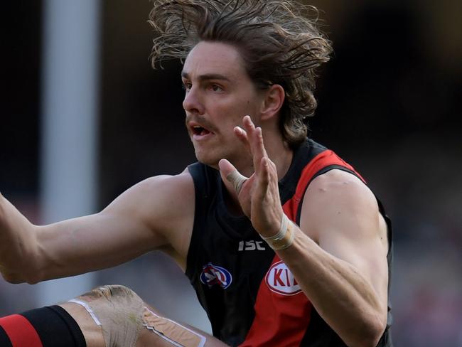 Joe Daniher of the Bombers attempts a goal kick during the Round 20 AFL men's match between the Essendon Bombers and the Carlton Blues at the MCG in Melbourne, Saturday, August 5, 2017. (AAP Image/Tracey Nearmy) NO ARCHIVING, EDITORIAL USE ONLY