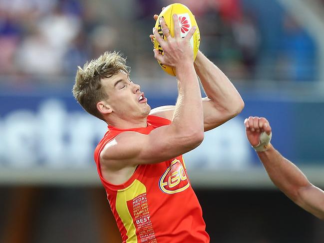 GOLD COAST, AUSTRALIA - JULY 01:  Tom Lynch of the Suns takes a mark during the round 15 the Gold Coast Suns and the North Melbourne Kangaroos at Metricon Stadium on July 1, 2017 in Gold Coast, Australia.  (Photo by Chris Hyde/Getty Images)