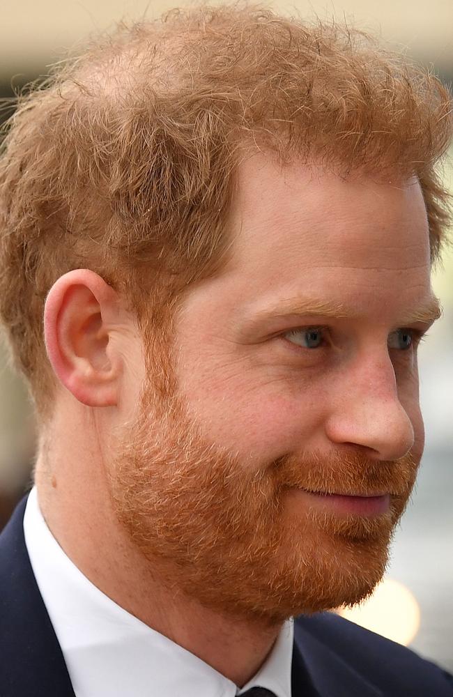 Hair to the throne … can Prince Harry hold onto his locks? Picture: AFP