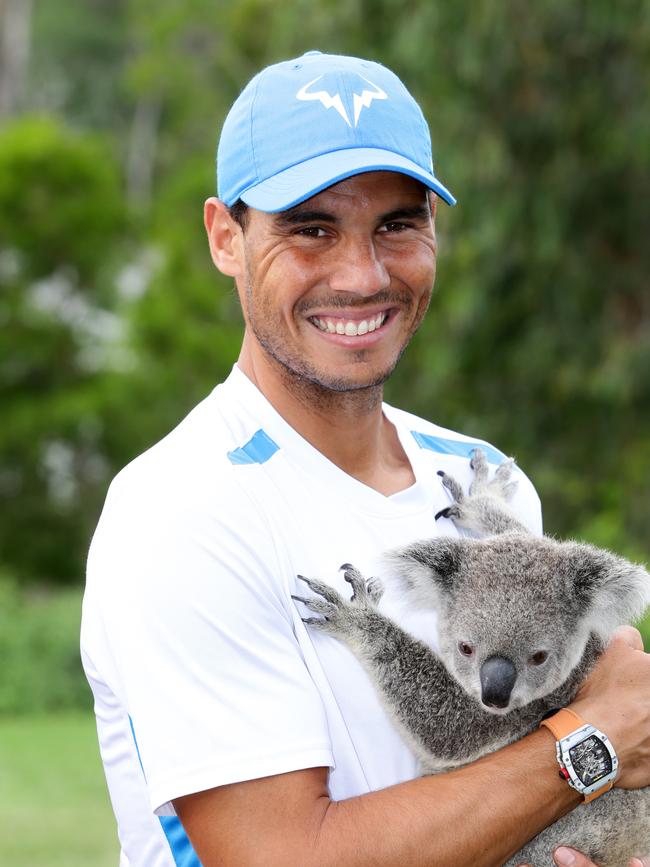 Rafael Nadal cuddles a Koala during the Brisbane International tennis. Pic Darren England.