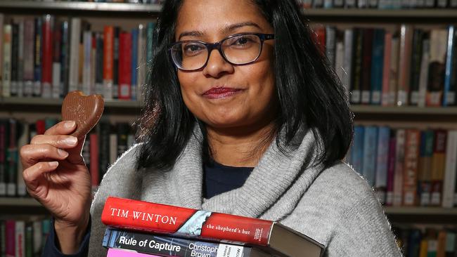 Anne Das with some books and chocolate for the reading event at Ivanhoe Library. Picture: George Salpigtidis.