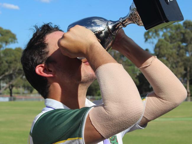 Dromana captain Kierran Voelkl drinks from the premiership cup. Picture: Adam Voigt