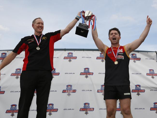 First flag: Dingley coach Shane Morwood and Tony Lavars with the premiership cup in 2015.