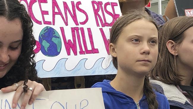 Swedish environmental activist Greta Thunberg, centre, participates in a demonstration in front of the United Nations in New York. Picture: AP Photo/Richard Drew