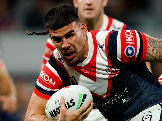 PERTH, AUSTRALIA - AUGUST 02: Terrell May of the Roosters attempts to break through the tacklers during the round 22 NRL match between Dolphins and Sydney Roosters at HBF Park, on August 02, 2024, in Perth, Australia. (Photo by James Worsfold/Getty Images)