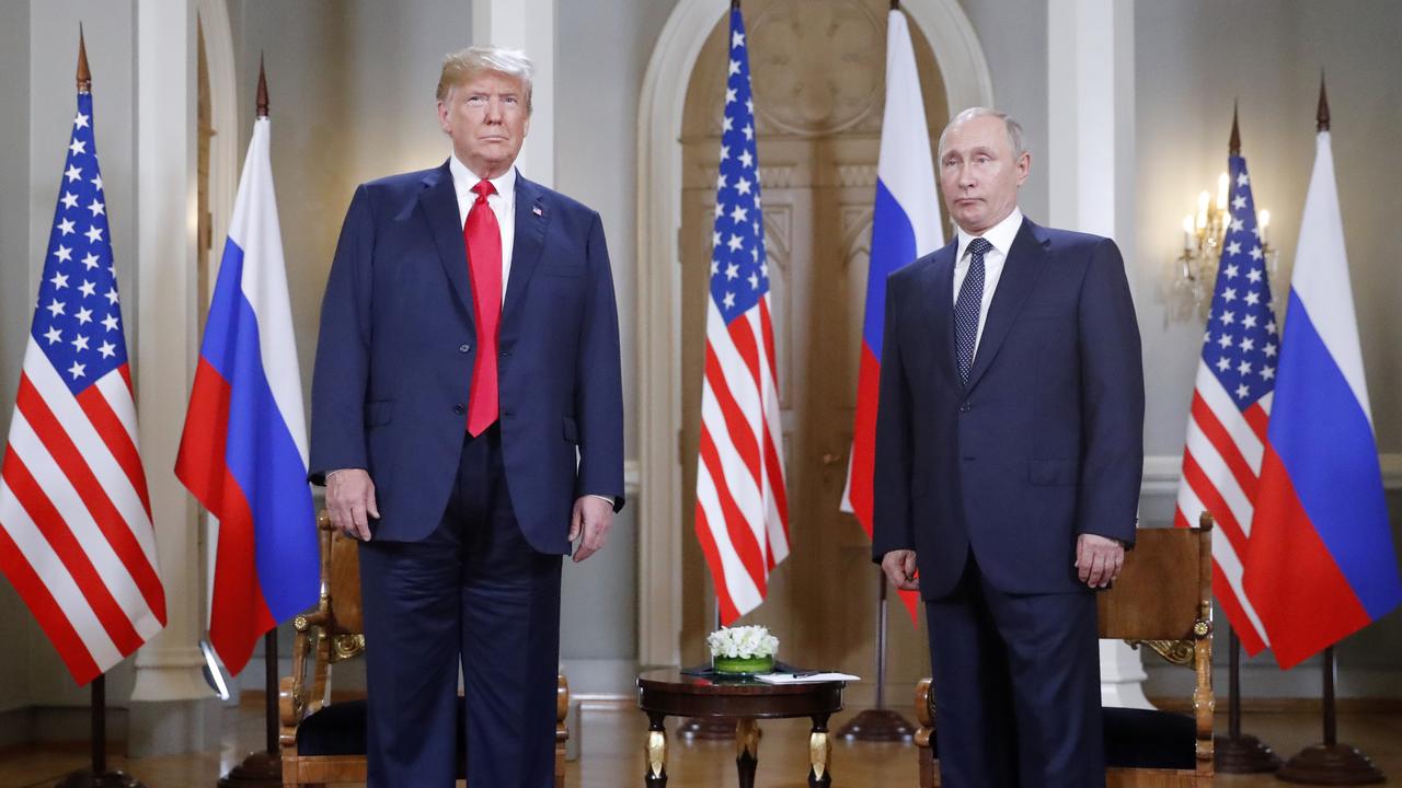 The US President and Russian President pose for a photograph at the beginning of a one-on-one meeting at the Presidential Palace in Helsinki, Finland on Monday. Picture: Pablo Martinez Monsivais/AP