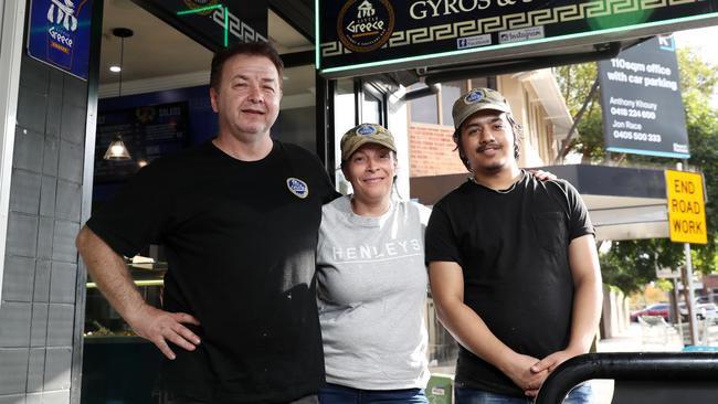 Laky Koumpridis (left) with his wife Maria and employee Bhabishya Khadka in front of their Little Greece Gyros and Souvlaki Bar. Picture: Jonathan Ng