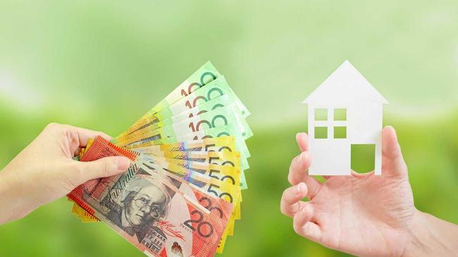 Client giving Australian money to property agent for buying house. Property and real estate concept. Picture: p_saranya