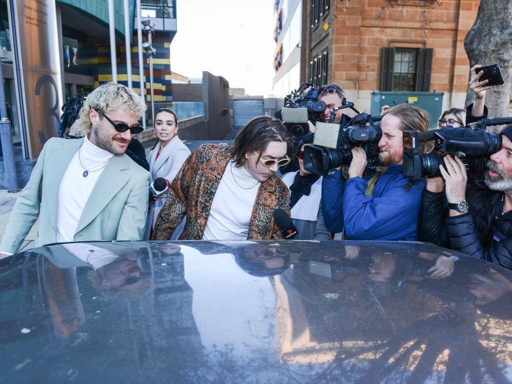 The two men put on a show outside the Adelaide Magistrates Court for waiting reporters in June last year. Picture: Brenton Edwards